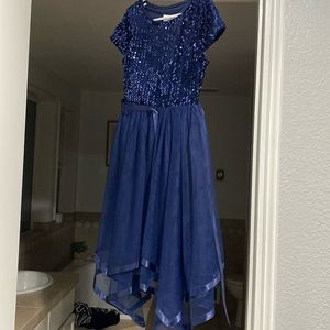 Girls dress size 8 blue sequins with a tule bottom. New with tags.
